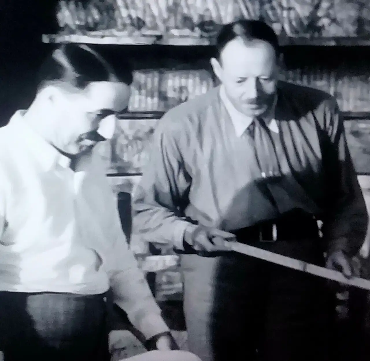 Howard Carter and Arthur Callender examining objects inside Tutankhamun's tomb in 1922